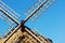 Windmill with blades against blue sky