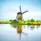 Windmill and canal in Kinderdijk, Holland or Netherlands. Unesco site