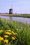 Windmill on a canal of Netherlands