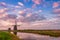 Windmill and Canal on Traditional Holland Landscape