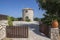 Windmill, Cape Skinari, Zakynthos - September 27, 2021: Beautiful traditional greece windmill on the rock up coastline