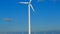 Windmill closeup on blue sky and windmills set background.Green energy. Alternative energy sources.Environmentally