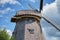 Windmill with cloudy sky