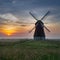 Windmill country landscape at sunset inspires with its beauty