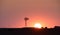 Windmill in countryside at sunset, Pampas,