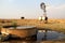 Windmill and dam on a farm in Northwest