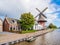 Windmill De Zwaluw and Dokkumer Ee canal in  Burdaard in Friesland, Netherlands