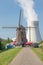 The windmill of Doel in the shadow of the nuclear power plant