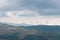 Windmill electricity turbines on a hill in Italian countryside