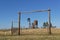 Windmill and fences in a western landscape