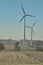 Windmill on the field. Production of energy from wind. Renewable resources. New technologies