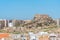 Windmill and fortress on Monte Sacro viewed from archeological park on cerro del molinete in Cartagena, Spain