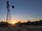 Windmill in front of sunset sky