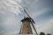 Windmill of Haastrecht along Hollandse IJssell with flags national Windmill day in the Netherlands