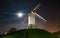 Windmill on a hill at night in Bruges, Belgium