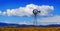 Windmill on Hillside in Countryside Rural America with Sky and C