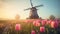 a windmill in the middle of a field of tulips