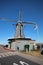 Windmill named `De Liefde` the Love along riverside of river Lek in Streefkerk, the Netherlands