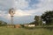 Windmill in Northwest, blue sky, white clouds late afternoon.