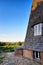 Windmill overlooking the church in Benz on the island of Usedom. Germany