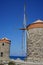 Windmill pier at the commercial harbor in Rhodes city. Rhodes, Greece