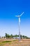 Windmill power generator in beautiful nature landscape for production of renewable green energy. Wind turbine generating