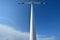 Windmill power generator under blue sky