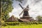 Windmill Rhaude in green nature in the county of Leer, East Frisia, Lower Saxony, Germany