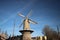 Windmill roode Leeuw in the old harbor of Gouda