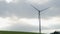 Windmill rotating blades convert wind energy to electrical