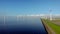 Windmill row of windmills in the ocean by the lake Ijsselmeer Netherlands, renewable energy windmill farm Flevoland