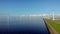 Windmill row of windmills in the ocean by the lake Ijsselmeer Netherlands, renewable energy windmill farm Flevoland