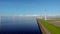 Windmill row of windmills in the ocean by the lake Ijsselmeer Netherlands, renewable energy windmill farm Flevoland