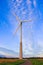 Windmill on rural field in the sunset. Wind turbines farm