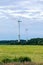 Windmill on rural field in the sunset. Wind turbines farm.