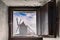 Windmill Seen Through A Open Window Of Another Mill With Fog In Consuegra. December 26, 2018. Consuegra Toledo Castilla La Mancha