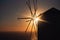 Windmill silhouette in front of the sunset