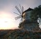 windmill on sunset background and plane travel technology concept