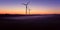 Windmill at Sunset . Wind turbines farm .