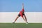 Windmill toe touch stretch dynamic stretching man standing training flexibility with back spinal twist exercise. Fitness