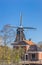 Windmill and traditional house in Eenrum