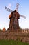 Windmill traditional rural wind energy mill farm power ecology watermill Flour mill, grinds grain. Windmill with millstones.