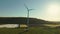 Windmill turbines at agricultural field on a bright summer day - Energy Production with clean and Renewable Energy