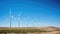 Windmill turbines in land, harnessing nature\\\'s renewable green energy