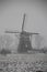 Windmill in the tweemanspolder during snowstorm in Zevenhuizen