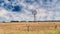 Windmill In Vast Open Outback Space