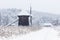 Windmill in Village Museum during snowy winter