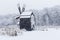 Windmill in Village Museum during snowy winter