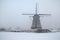 Windmill in winter in Holland