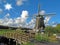 Windmill with wooden bridge